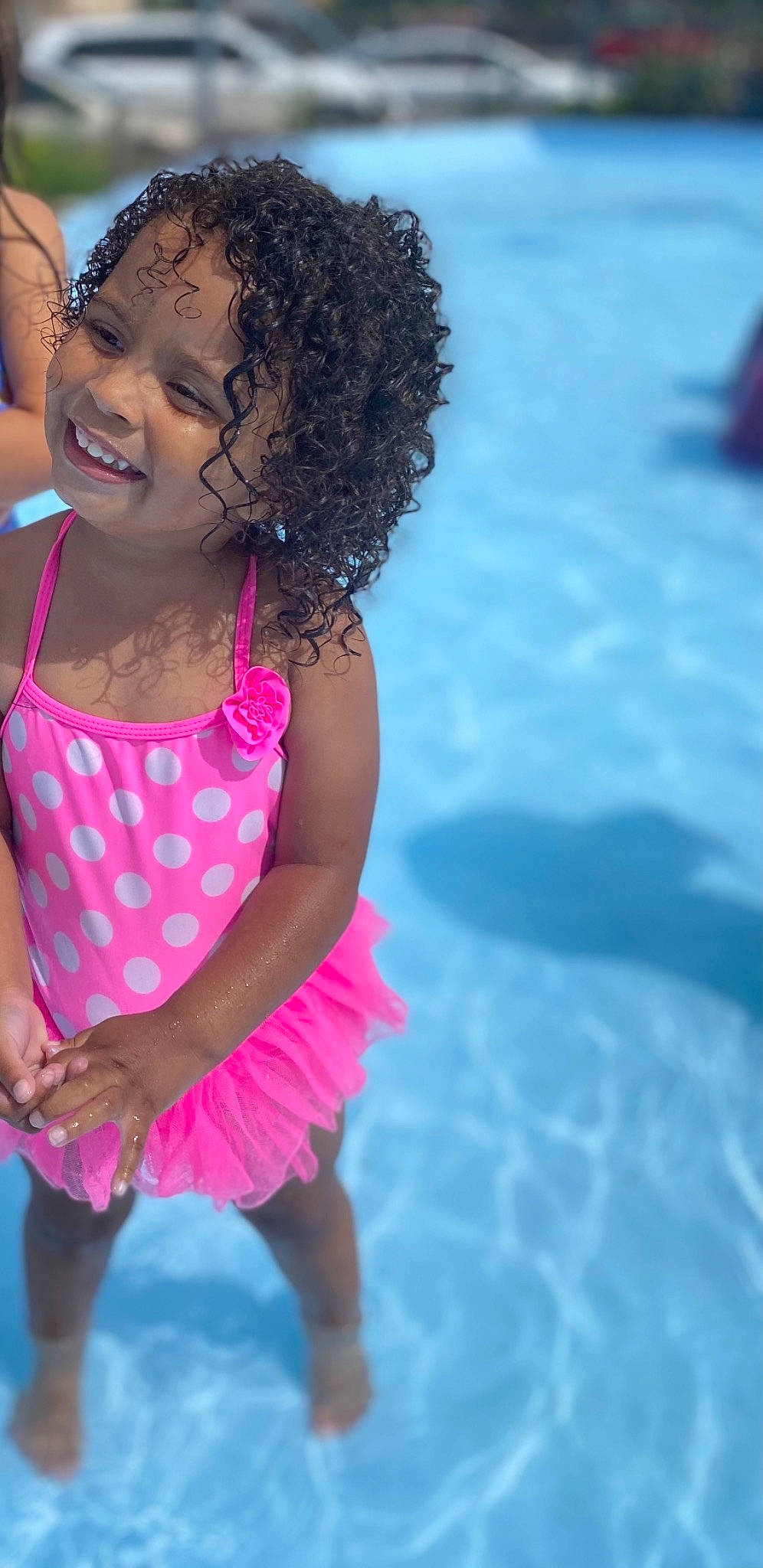 Milani joined the competition — help win amazing prizes! baby_toddler_clothing, child, event, face, fashion_accessory, fun, happy, jewellery, joy, leisure, magenta, ocean, people_on_beach, person, pink, recreation, summer, swimming_pool, swimwear, thigh