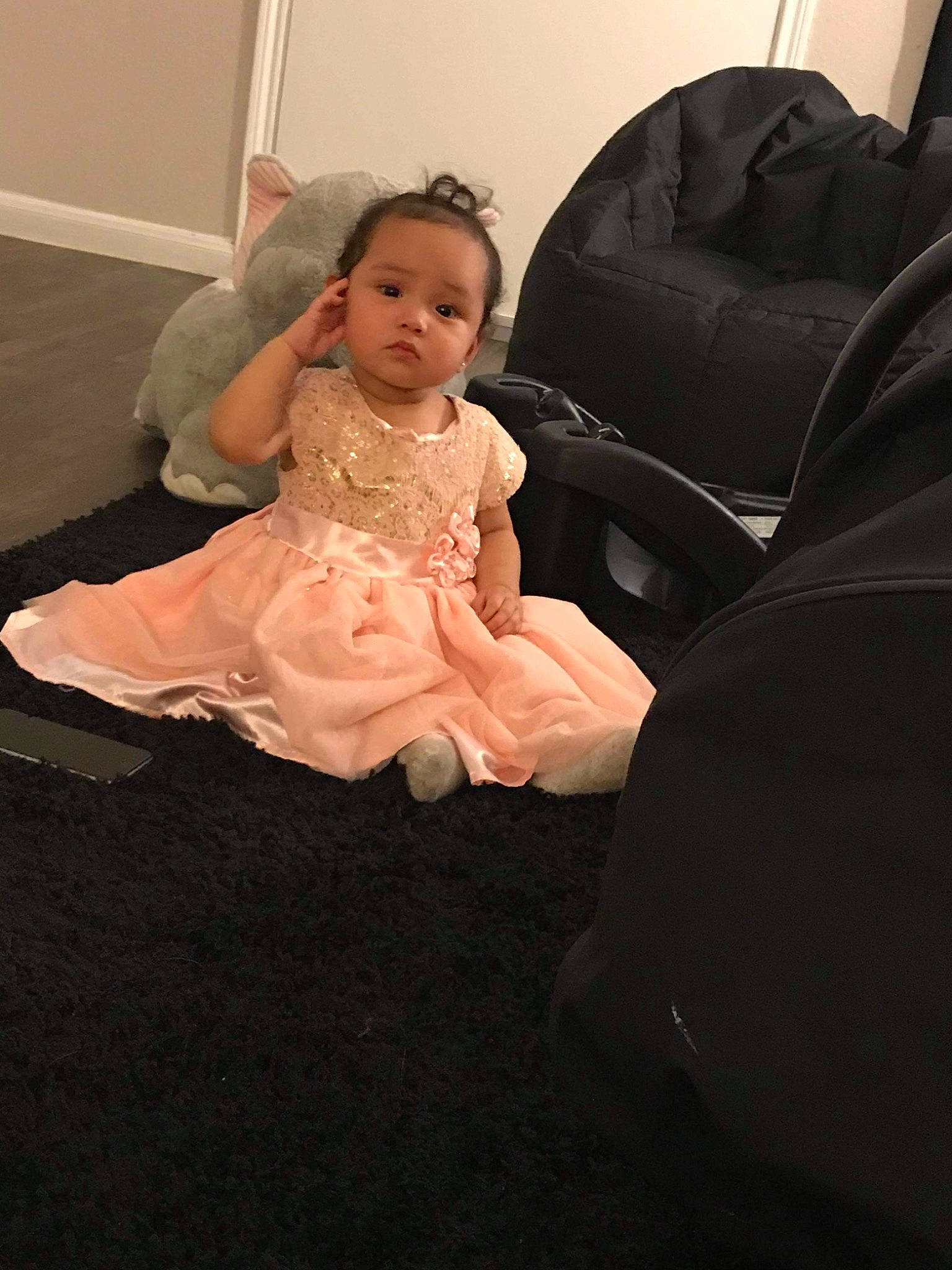 Sasha joined the competition — help win amazing prizes! baby, chair, child, dress, floor, flooring, formal_wear, fun, leg, person, pink, room, sitting, skin, smile, toddler