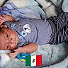 Angelo joined the competition — help win amazing prizes! baby, baby_boy, blanket, child, comfort, cute, face, hand, indoors, infant, lying_down, mexican_flag, newborn, pacifier, portrait, resting, sleepy, soft_texture, striped_clothing, striped_outfit