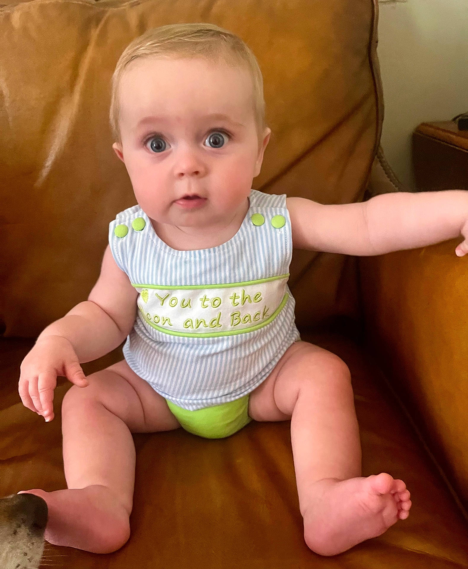 Henry is registered to the contest to win money with this photo: baby, blonde, bodypart, chair, couch, crawling, cushion, diaper, face, finger, furniture, hair, hand, head, homedecor, newborn, person, photography, portrait, sitting