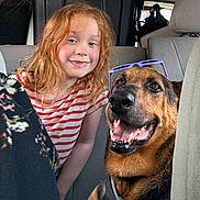 Lady joined the competition — help win amazing prizes! car_interior, casual, child, companion, dog, domestic_animal, friendship, german_shepherd, glasses, happy, indoor, leisure, pet, portrait, red_hair, seat, smiling, striped_shirt, travel, young_girl