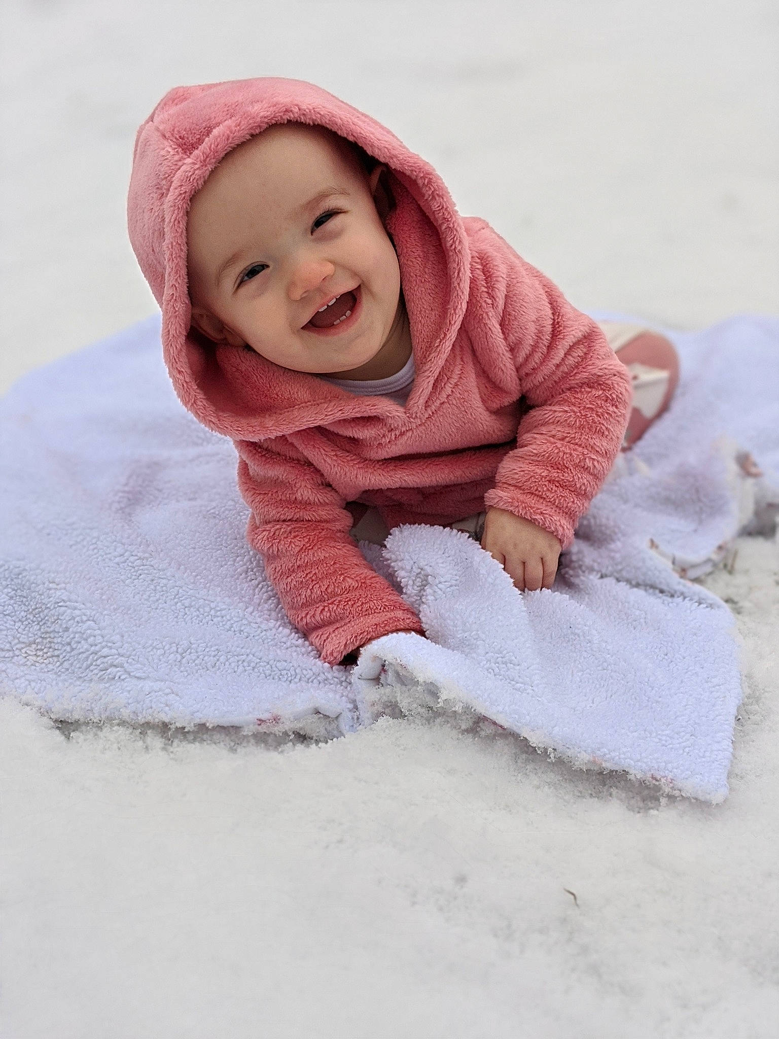 Mckynlee joined the competition — help win amazing prizes! baby, baby_toddler_clothing, blanket, bonnet, child, freezing, hood, linens, outerwear, person, pink, play, playing_in_the_snow, skin, smile, snow, textile, toddler, white, winter