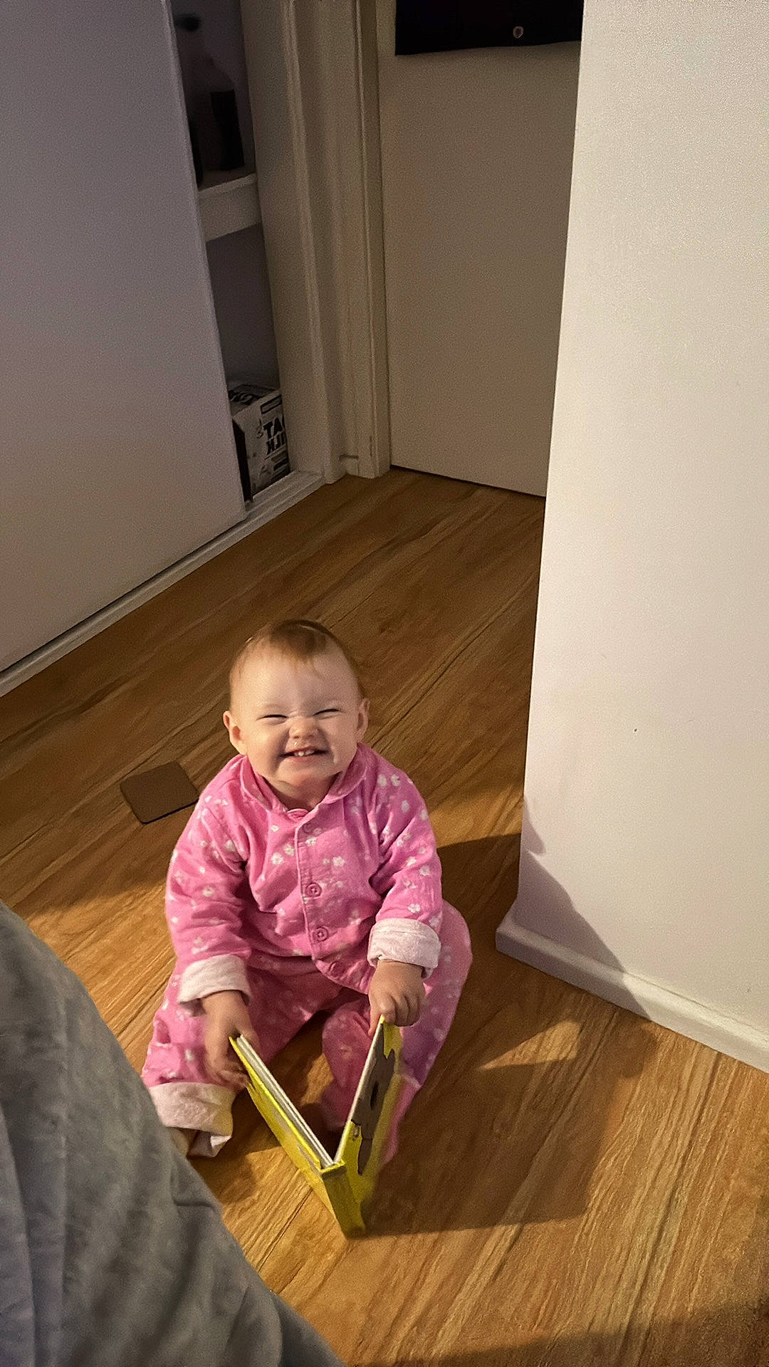 Olivia joined the competition — help win amazing prizes! baby, baby_toddler_clothing, child, comfort, door, floor, flooring, fun, hardwood, joy, laminate_flooring, person, sitting, skin, sleeve, smile, standing, toddler, varnish, wood