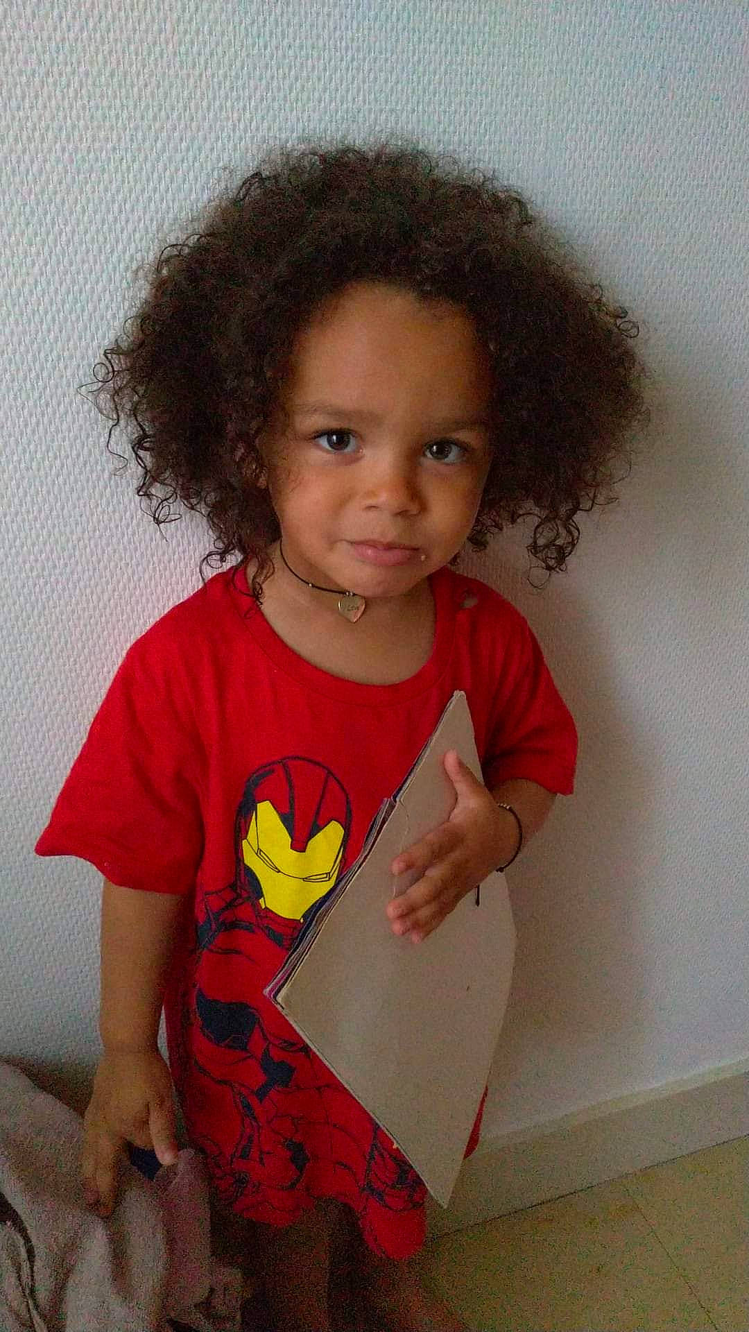 Nnagbe participe au concours pour gagner de l'argent avec cette photo : afro, arm, baby_toddler_clothing, beauty, cheek, child, clothing, fun, hair, happy, human_body, iris, lip, neck, nose, person, skin, sleeve, standing, t_shirt