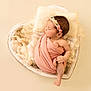 newborn, baby, sleeping, blanket, headband, heart_shaped_basket, wool, soft, pink, cream, wrapped, peaceful, infant, cute, portrait, resting, child, cozy, studio, photography