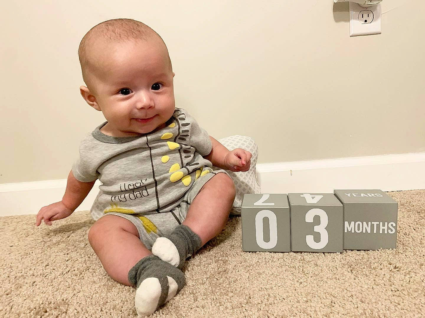 Alejandro is registered to the contest to win money with this photo: arm, baby, baby_toddler_clothing, cheek, child, finger, floor, flooring, foot, fun, happy, human_leg, joint, knee, person, play, sitting, sleeve, smile, thumb