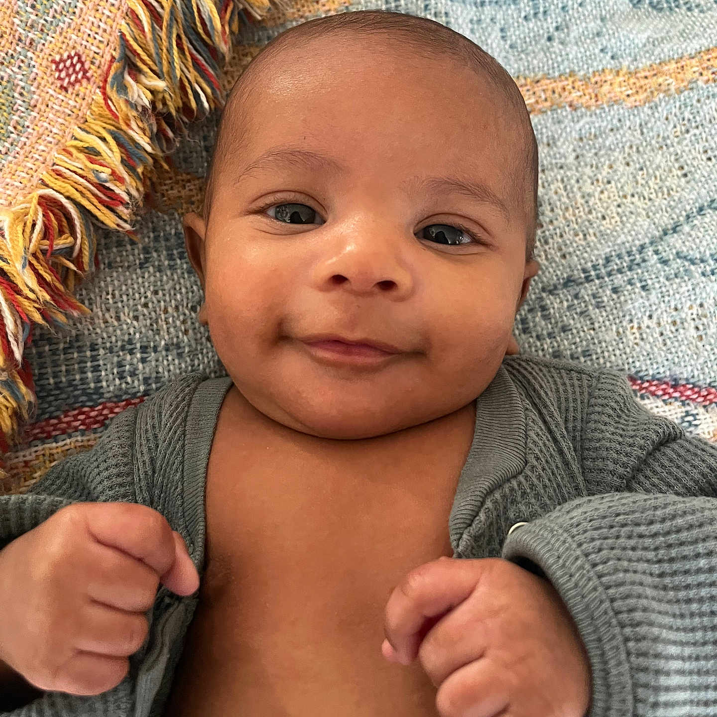 Kashawn is registered to the contest to win money with this photo: baby, babylaughing, blanket, bodypart, clothing, face, finger, hand, happy, head, knitwear, newborn, pants, person, photography, portrait, quilt, shoulder, smile, sweater