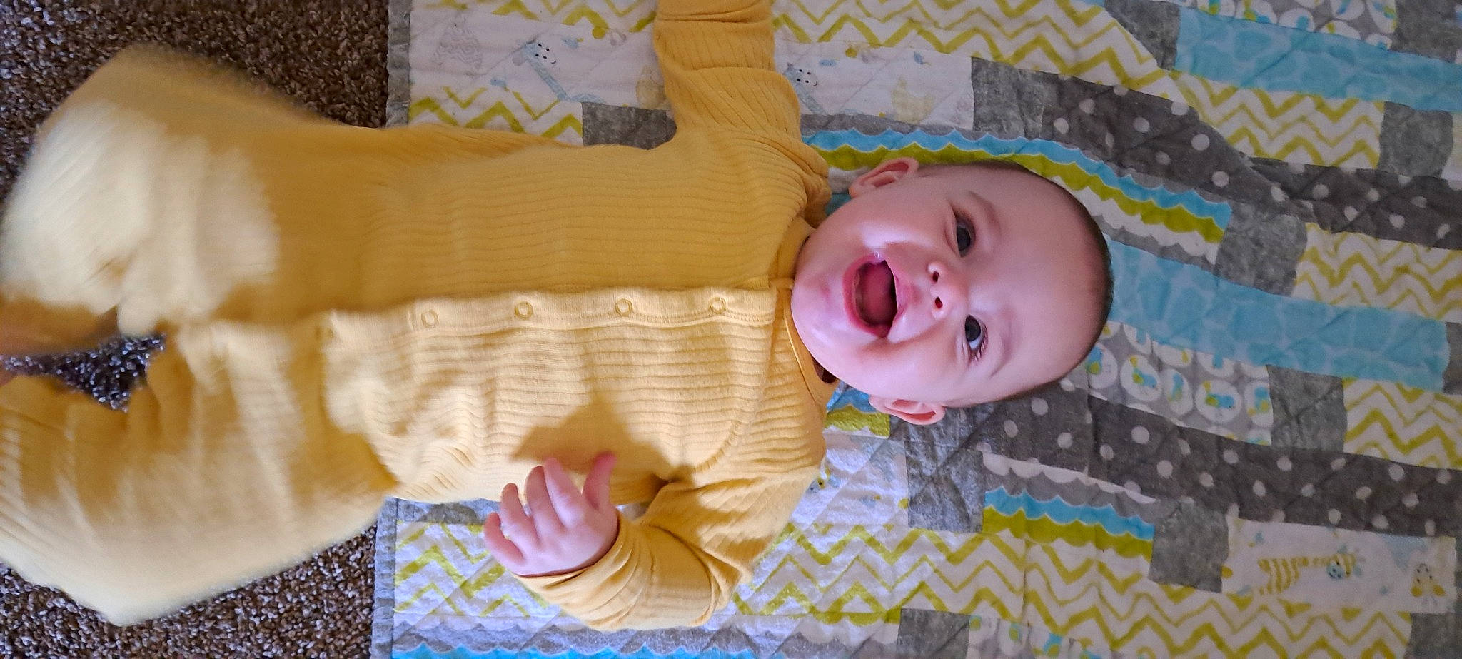 Michael is registered to the contest to win money with this photo: baby, baby_products, baby_safety, baby_toddler_clothing, bedding, cheek, child, comfort, flooring, happy, infant_bed, linens, pattern, person, pink, product, skin, smile, textile, toddler