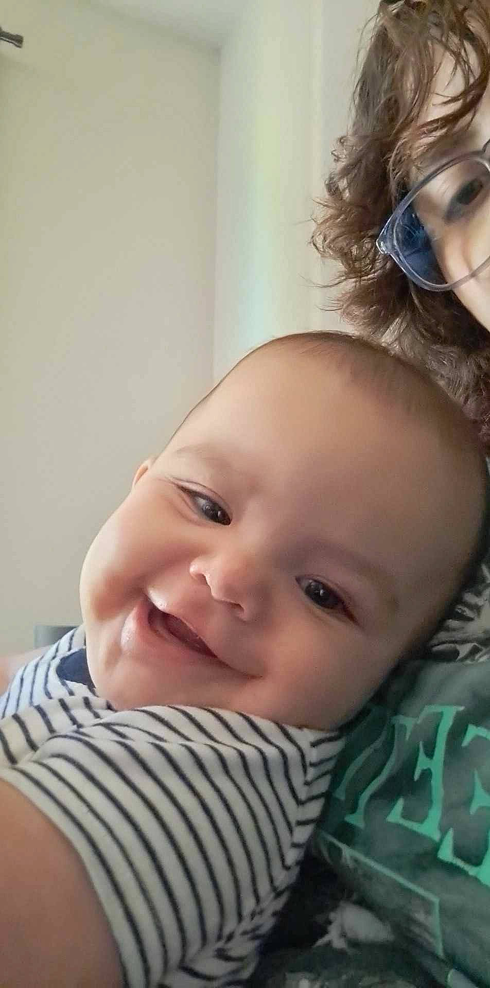 Michael is registered to the contest to win money with this photo: baby, cheek, chin, eye, eyebrow, eyelash, face, facial_expression, hairstyle, happy, head, human, iris, joy, lip, mammal, mouth, nose, person, shoulder