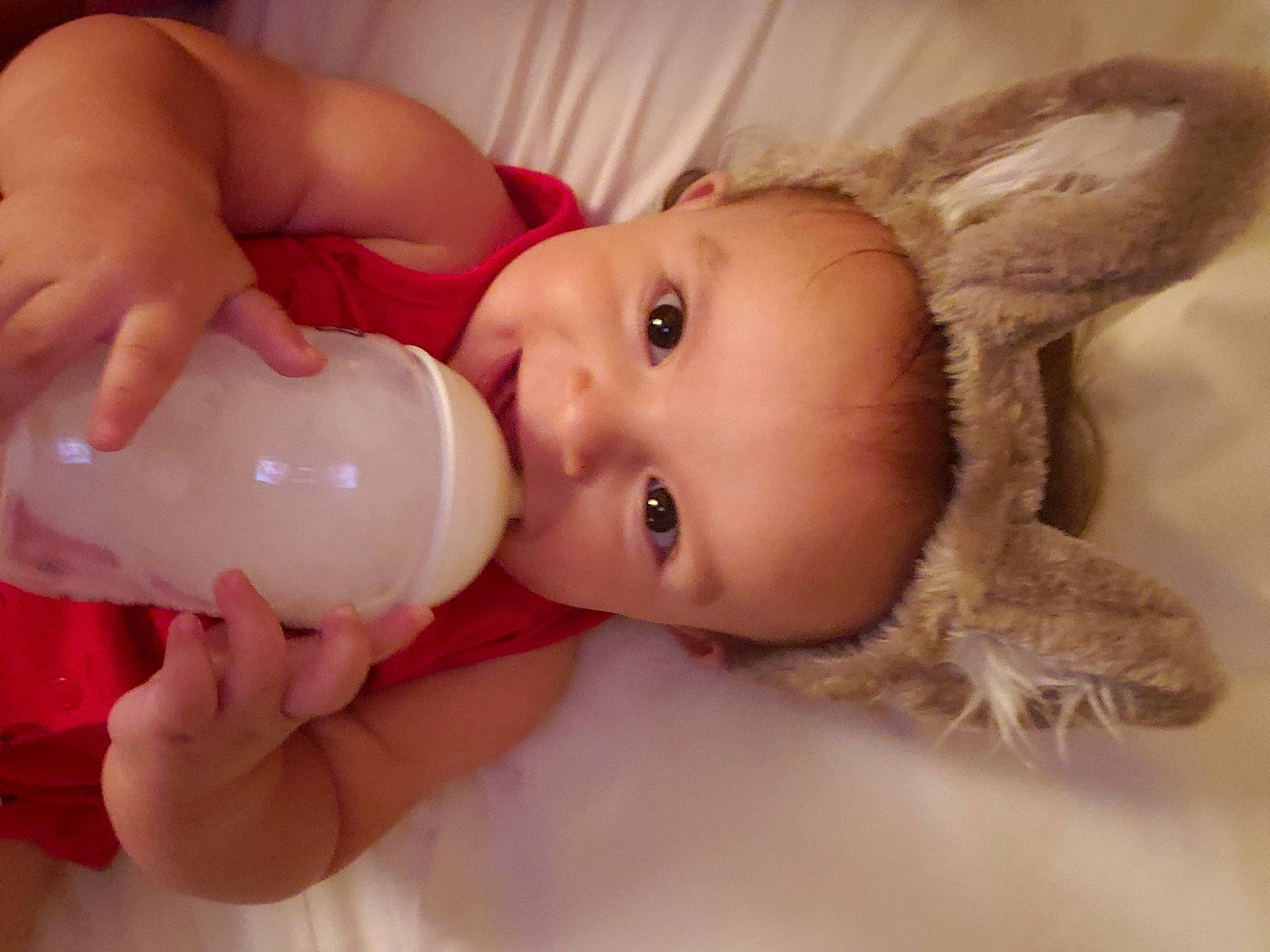 Andrew is registered to the contest to win money with this photo: baby, baby_bottle, baby_bottle_feeding, bottle, cheek, chest, drinkware, eyelash, gesture, hand, happy, head, human_body, infant_formula, lip, nail, nose, person, plastic_bottle, skin