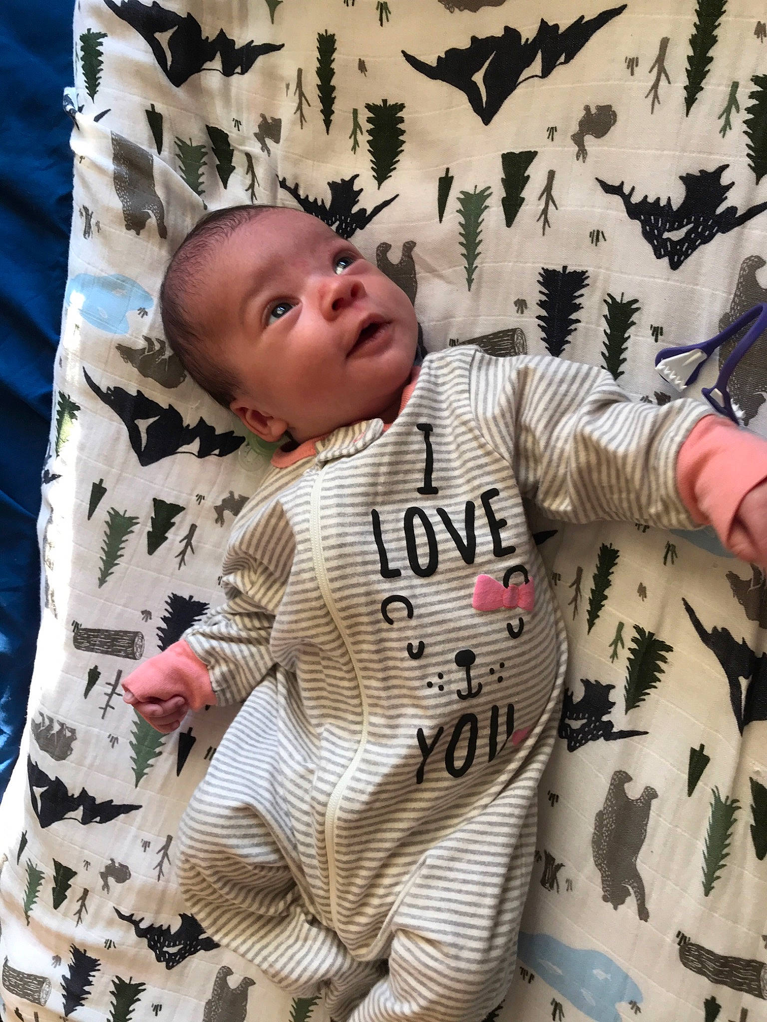 Azrael is registered to the contest to win money with this photo: art, baby, baby_toddler_clothing, bedding, child, comfort, font, gesture, happy, linens, military_camouflage, pattern, person, product, room, sleeve, t_shirt, textile, toddler, world