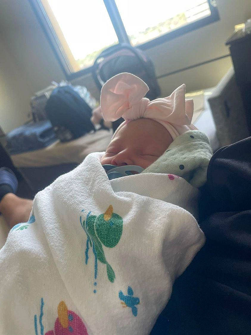 Leilani joined the competition — help win amazing prizes! baby, baby_products, bedding, blanket, child, comfort, craft, driving, eyewear, hat, linens, passenger, person, room, sitting, sleeve, t_shirt, textile, thumb, toddler