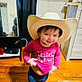architecture, baby, building, cap, clothing, costume, cowboyhat, door, face, hardwood, hat, head, jeans, pants, person, photography, portrait, sunhat, t_shirt, wood