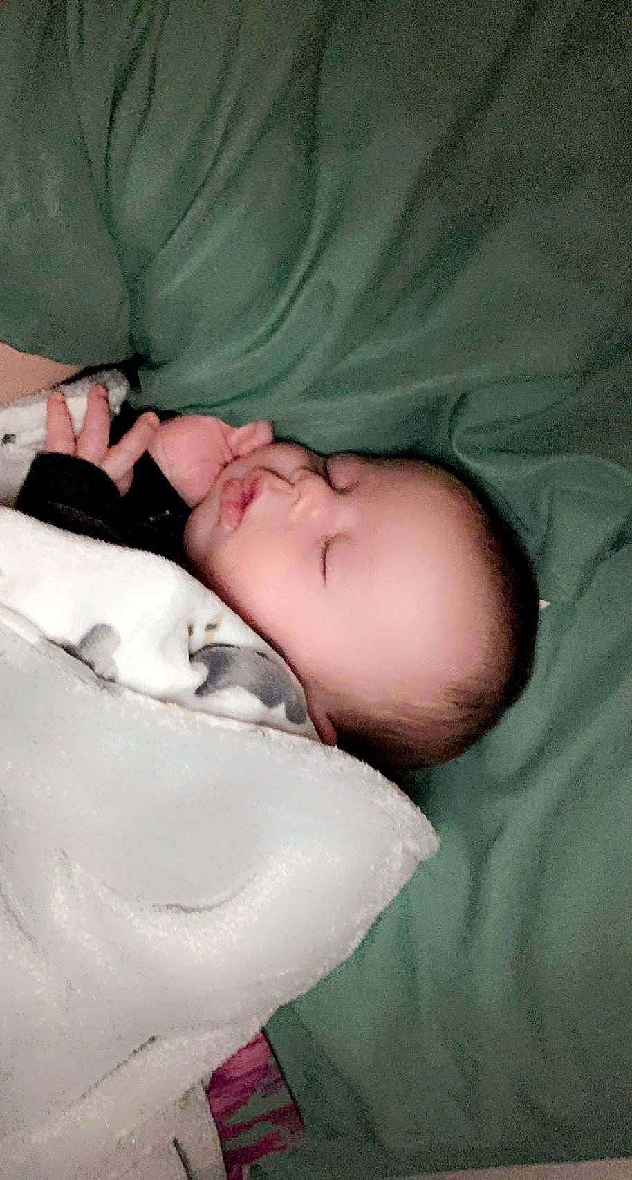 Archer is registered to the contest to win money with this photo: baby, bedtime, cheek, child, comfort, eyelash, flesh, fur, linens, nap, neck, nose, pattern, person, portrait_photography, room, skin, sleep, toddler