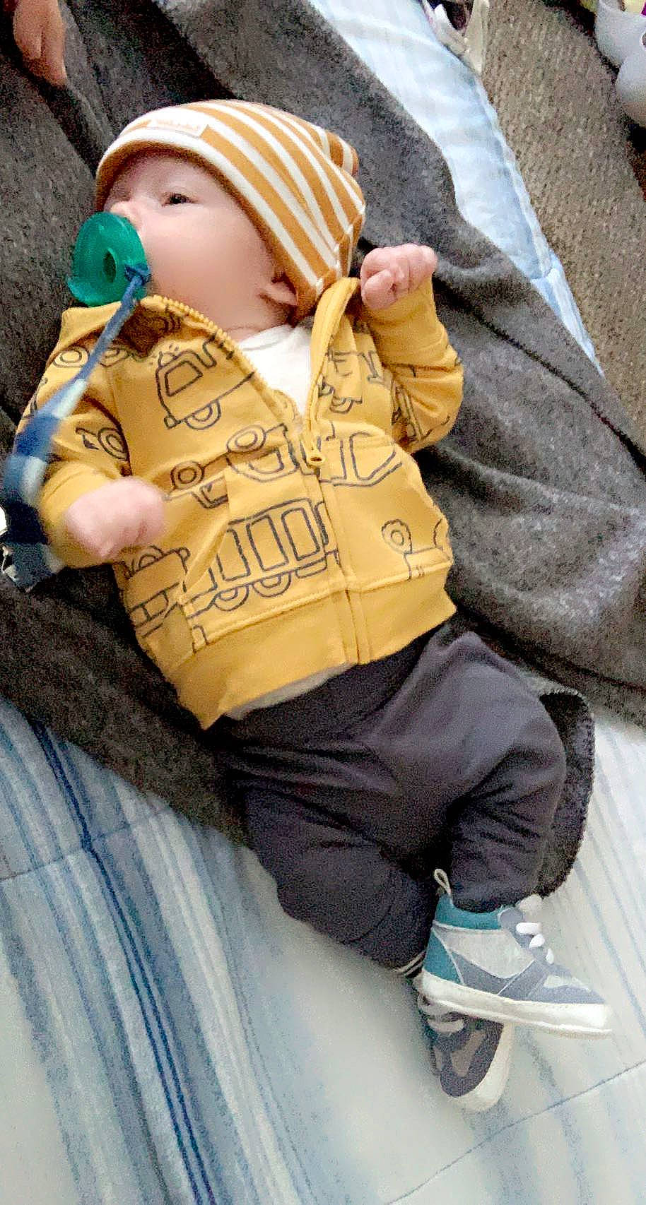 Archer joined the competition — help win amazing prizes! baby, beanie, cap, child, cool, denim, eye, fashion_accessory, fur, hood, hoodie, human_leg, knit_cap, person, personal_protective_equipment, sitting, sleeve, thigh, toddler, tree