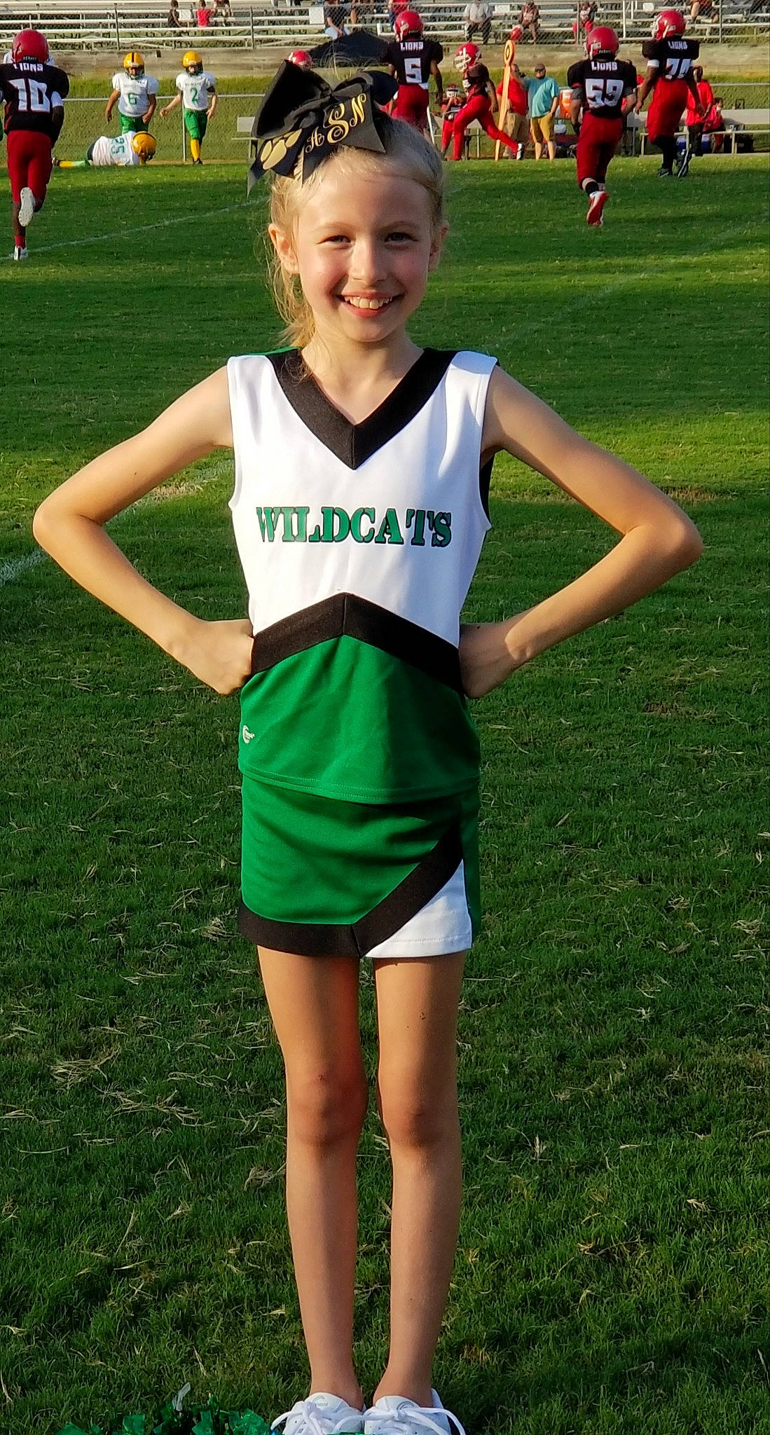 Addison joined the competition — help win amazing prizes! cheerleading_uniform, competition_event, grass, joy, person, player, recreation, sports, sports_uniform, team, team_sport, uniform