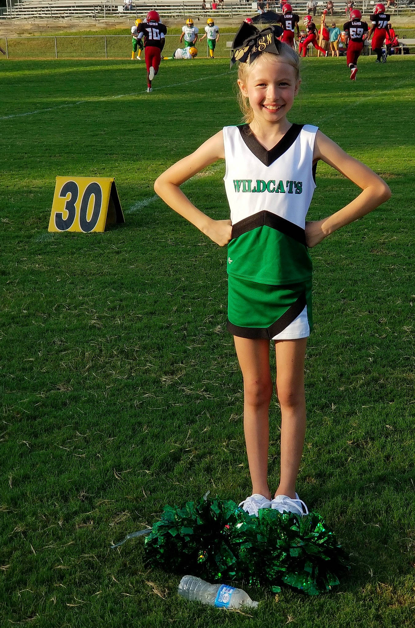Addison joined the competition — help win amazing prizes! cheerleading_uniform, competition_event, grass, joy, lawn, person, player, recreation, running, sports, sports_uniform, team, team_sport, uniform