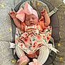 baby, sleeping, pink_bow, floral_dress, baby_shoes, baby_seat, graco, stars, moons, white_tights, infant, cute, cozy, child, resting, adorable, small_hands, soft_lighting, indoor, newborn