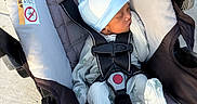 Terrion joined the competition — help win amazing prizes! baby, infant, car_seat, sleeping, pajamas, hat, dinosaur_hat, child, straps, safety, outdoor, sunlight, cozy, cute, peaceful, newborn, portrait, seat, fabric, comfort