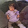 baby, bow, child, comfortable, couch, cozy, cute, fashion, headband, indoor, infant, leggings, leopard_print, pillows, plush, portrait, purple_clothing, resting, socks, soft_texture