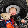 Elizabeth joined the competition — help win amazing prizes! baby, blanket, bundle_up, child, coat, cold_weather, cute, face, hood, outdoor, person, playful, protective_cover, smiling, stroller, teddy_bear, toddler, tongue_out, toy, winter_clothing