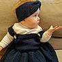 baby, blanket, bonnet, cap, clothing, costume, couch, cushion, face, furniture, hair, hat, head, homedecor, knitting, knitwear, person, photography, portrait, sweater