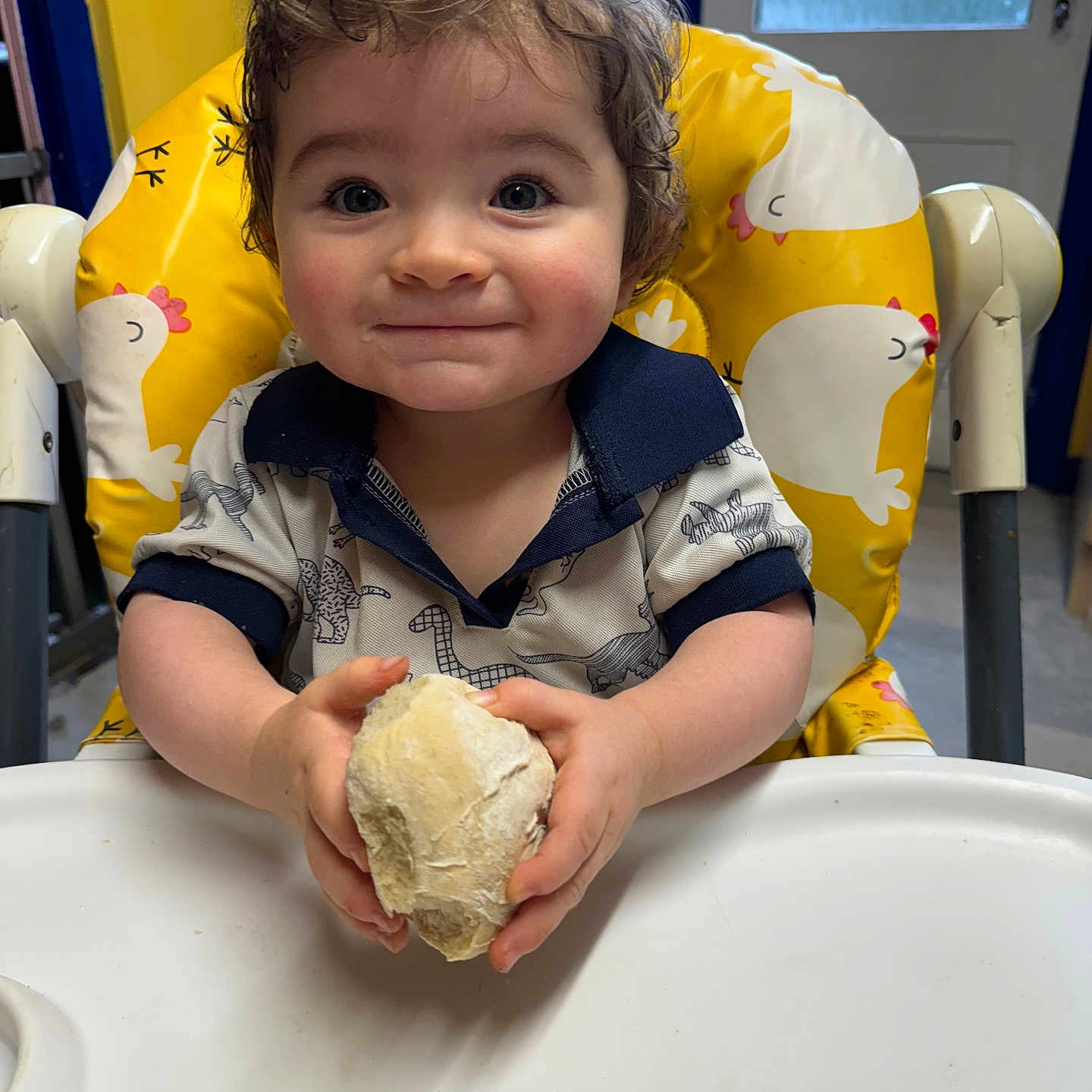 Argyll is registered to the contest to win money with this photo: baby, bodypart, bread, chair, cream, dessert, eating, face, finger, food, furniture, hand, happy, head, icecream, icing, person, photography, portrait, smile