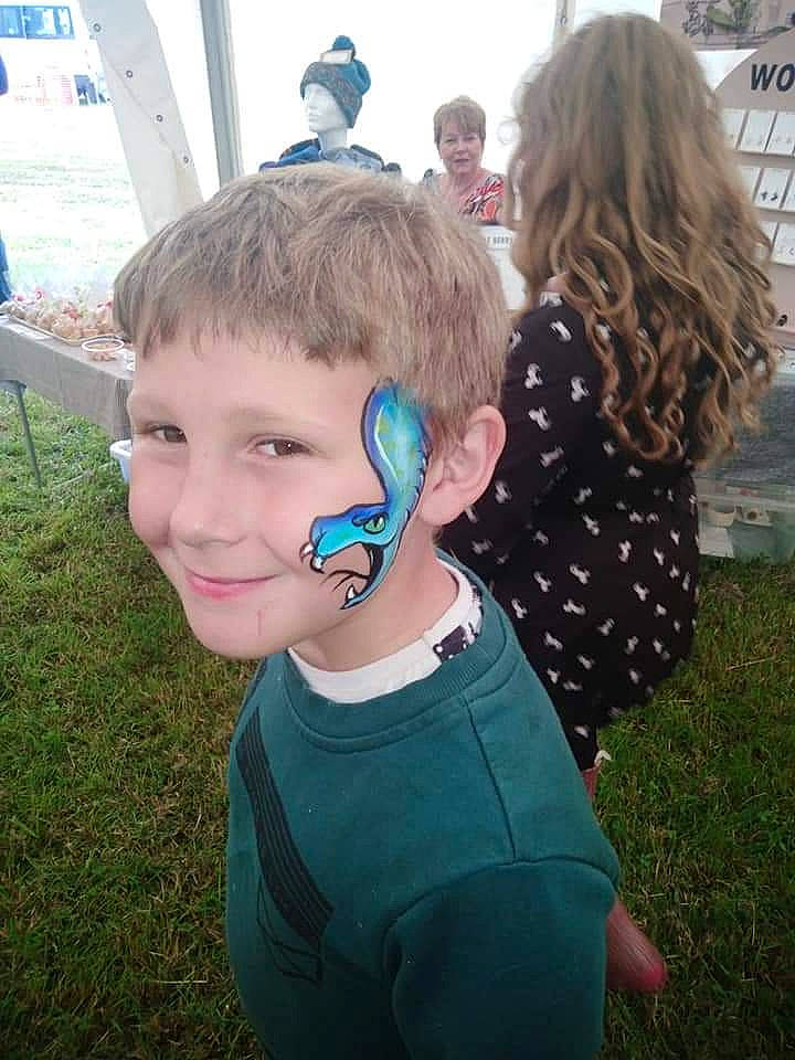 Troy is registered to the contest to win money with this photo: blond, cheek, child, cool, ear, electronic_device, eye, face, fashion_accessory, fun, grass, hair, hair_accessory, hairstyle, head, joy, person, summer, technology, toddler