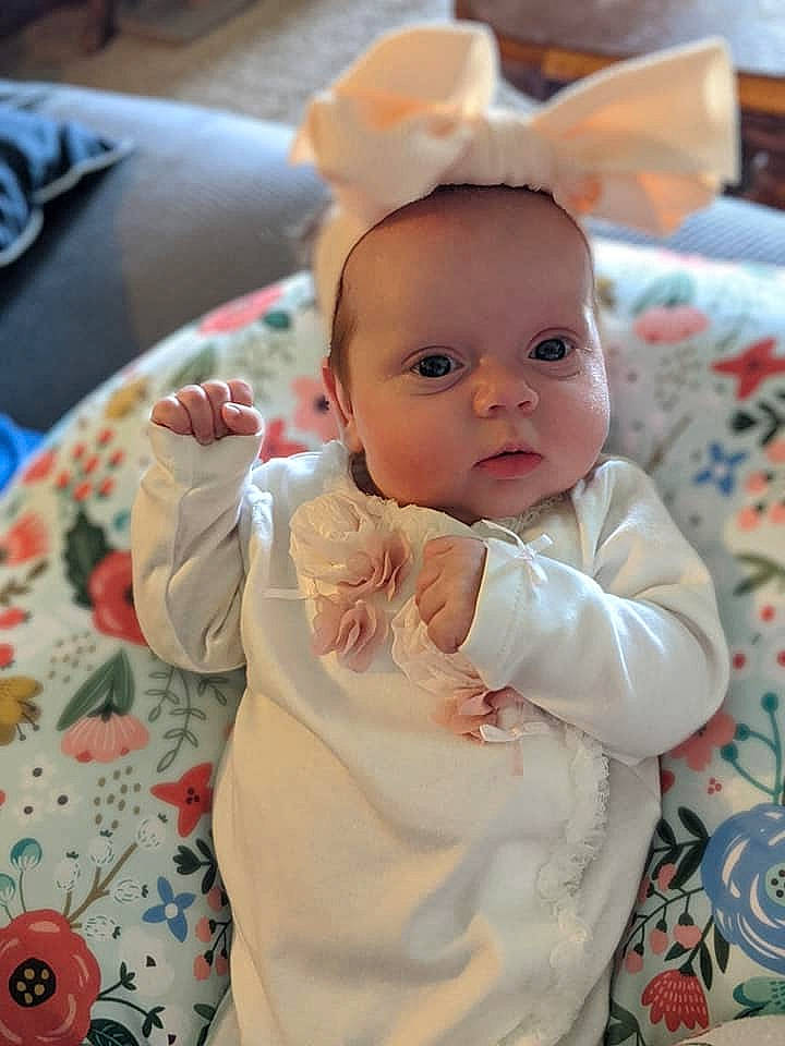 Elora is registered to the contest to win money with this photo: baby, baby_products, baby_toddler_clothing, cheek, child, eye, home_accessories, human_body, linens, person, skin, toddler