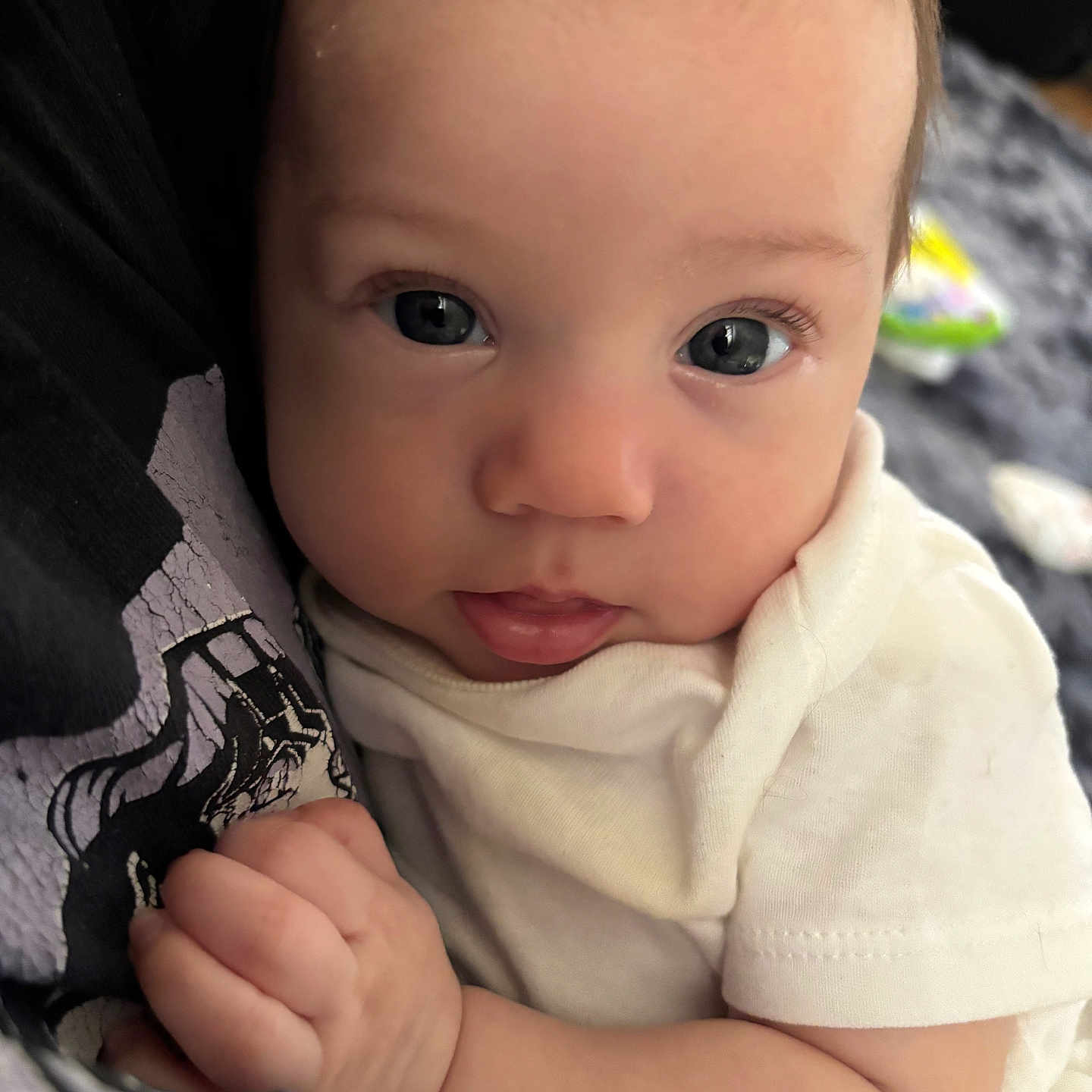 Viviyanna joined the competition — help win amazing prizes! baby, close_up, clothing, curious, cute, expression, eye_contact, face, hand, holding, indoor, infant, person, portrait, skin, small_fingers, soft_light, toddler, white_shirt, young_child