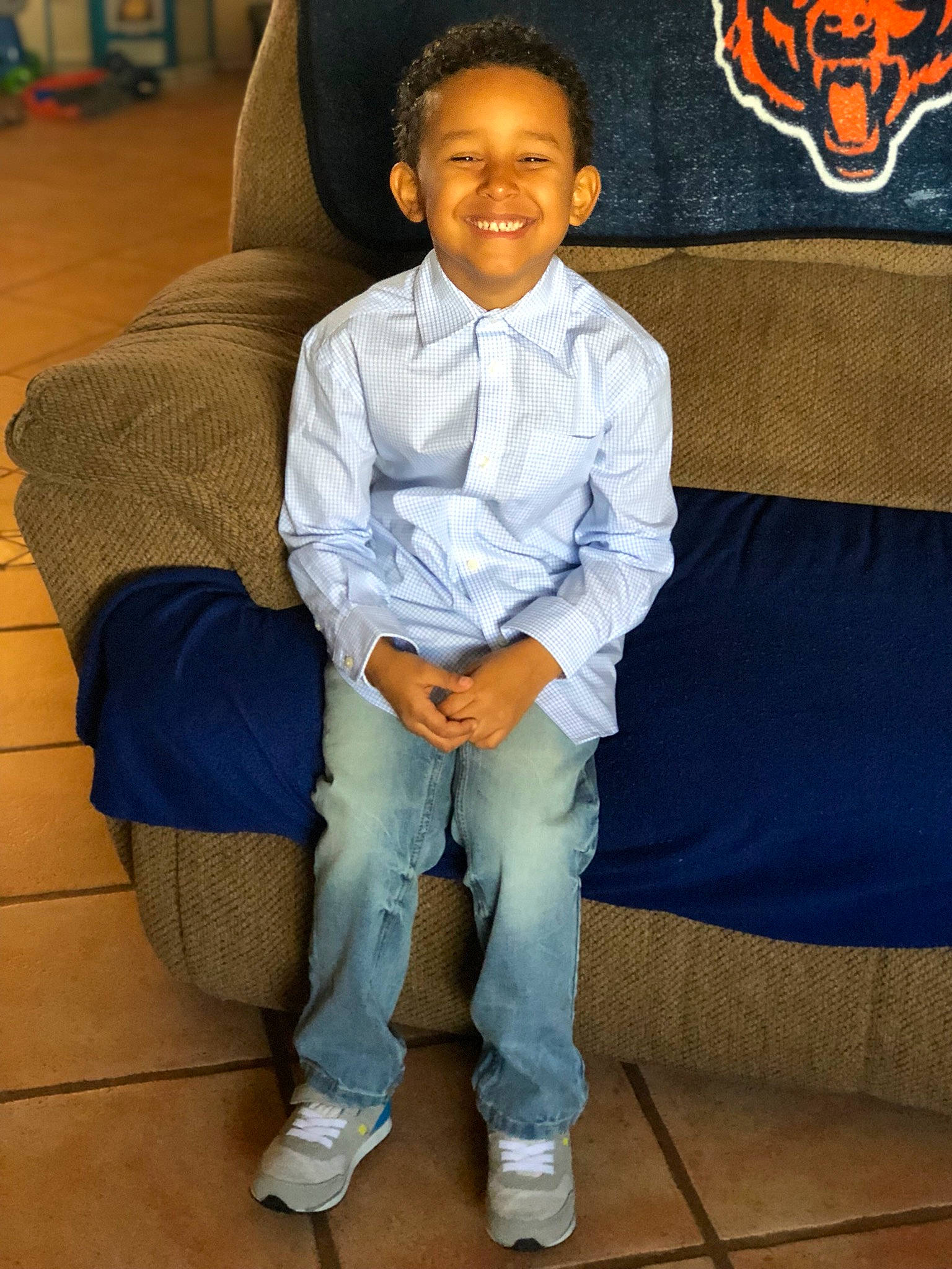 Azriel is registered to the contest to win money with this photo: child, joy, person, shoe, sitting