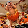 Lorraine joined the competition — help win amazing prizes! baby, infant, child, smiling, happy, autumn, fall, pumpkin, pumpkin_patch, harvest, leaves, autumn_leaves, wreath, indoor, portrait, sitting, seasonal_decor, letter_board, milestone, family_photo