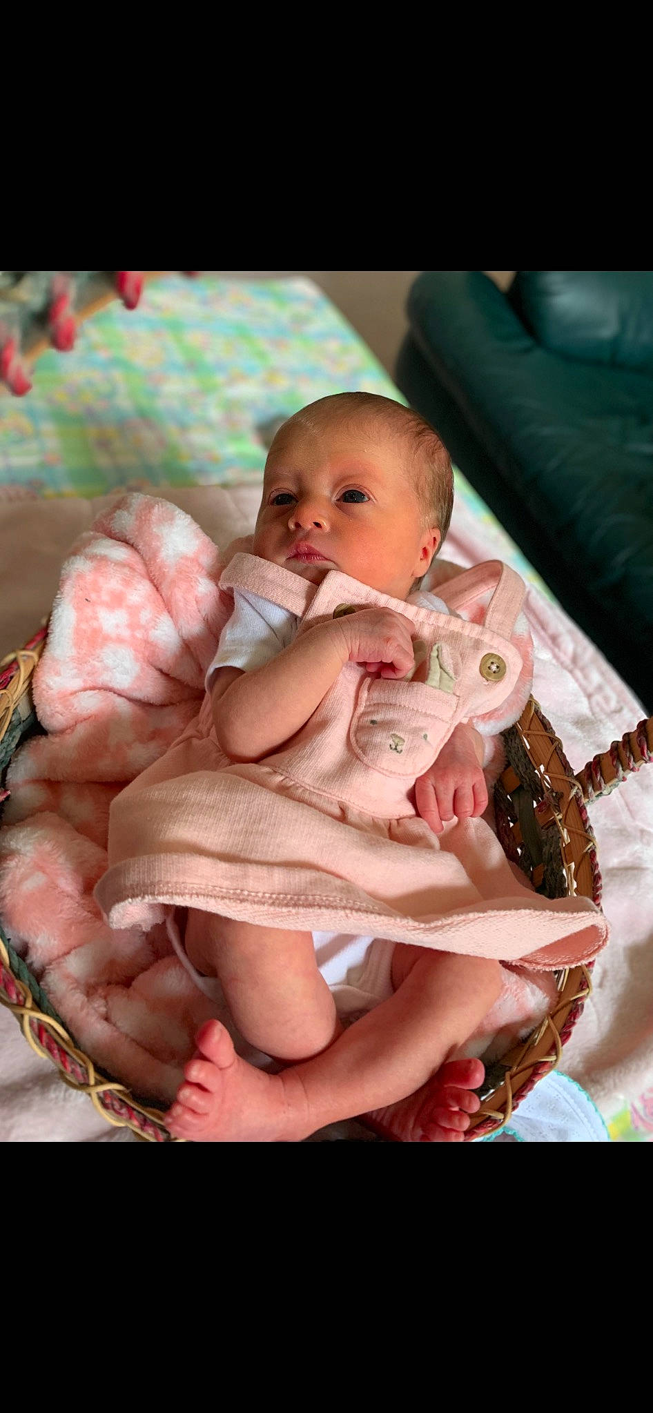 Brinley is registered to the contest to win money with this photo: abdomen, baby, baby_products, baby_toddler_clothing, cheek, child, comfort, flash_photography, foot, happy, human_body, human_leg, linens, nail, person, pink, sitting, skin, stomach, thumb