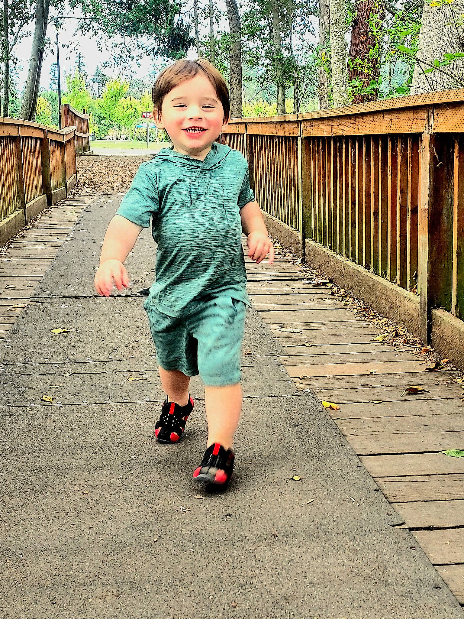 Jaxyn joined the competition — help win amazing prizes! baby_toddler_clothing, child, fence, fun, grass, happy, human_leg, joy, leisure, pattern, people_in_nature, person, plant, recreation, sky, sleeve, smile, t_shirt, toddler, tree