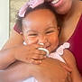 Dakota is registered to the contest to win money with this photo: baby, child, smile, pacifier, pink_bow, pink_outfit, arm, hand, embrace, happy, cute, infant, person, face, closeup, skin, indoor, joyful, love, family
