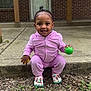 Sayari is registered to the contest to win money with this photo: bare_ears, brick_wall, casual_clothing, child, colorful_shoes, concrete_step, cute, door, grass, green_ball, leaves, outdoor, person, pink_outfit, smile, squatting, toddler, topknot, yellow_ball, young_child