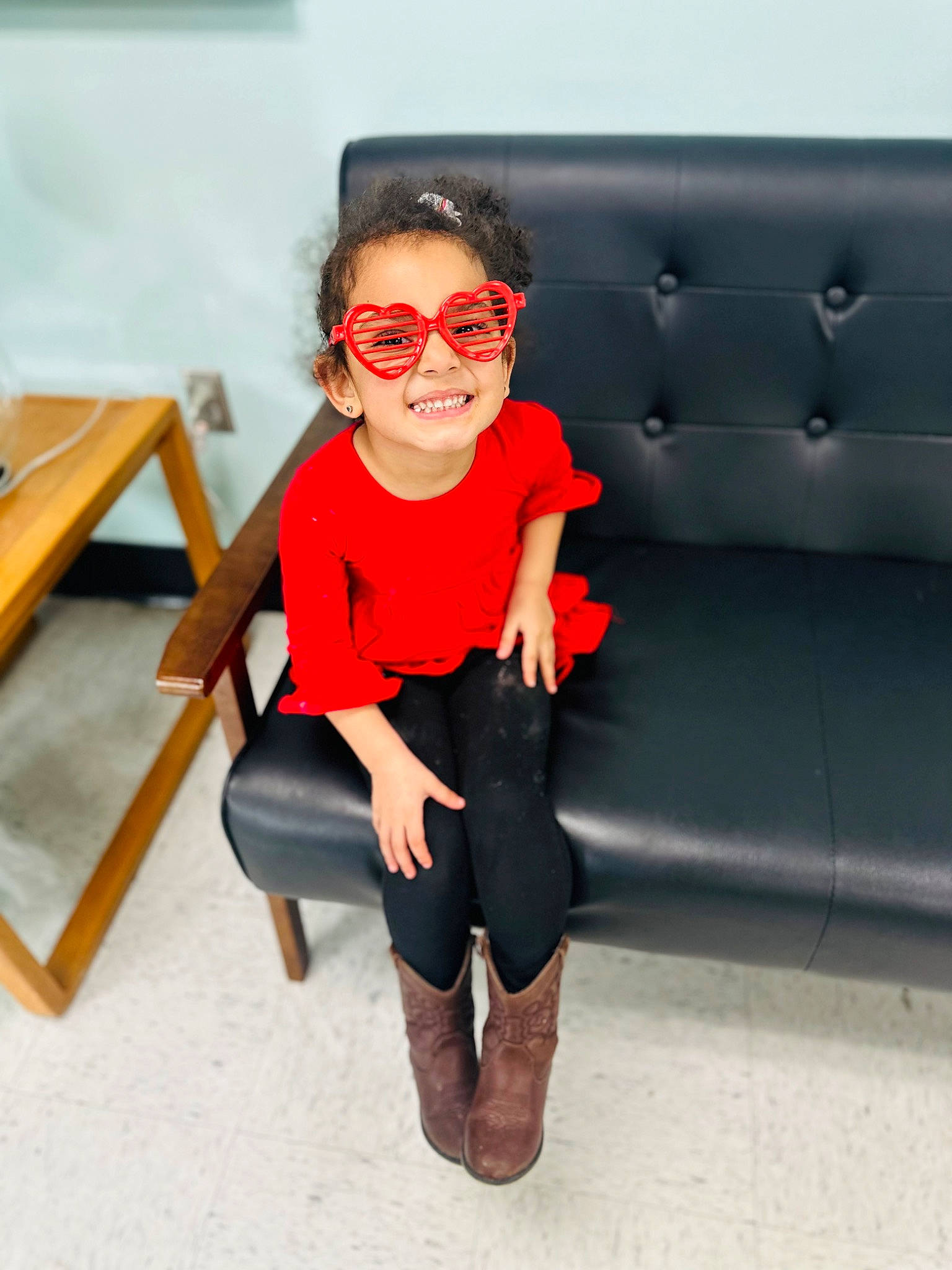 Gracie is registered to the contest to win money with this photo: denim, eyewear, fashion_design, flooring, glasses, goggles, human_leg, joint, joy, knee, leisure, person, shorts, shoulder, sleeve, sportswear, sunglasses, thigh, toddler, vision_care
