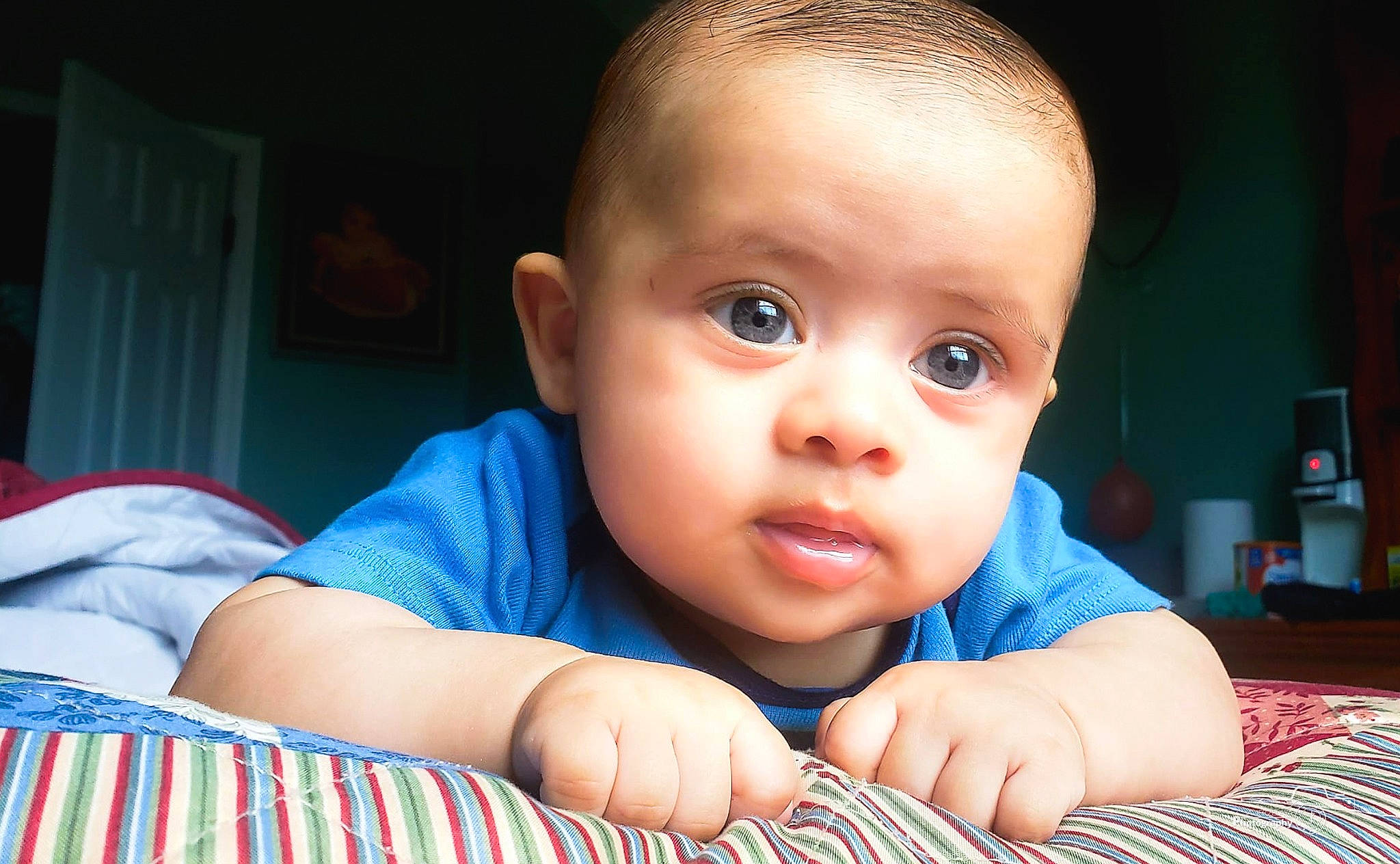 Marvin is registered to the contest to win money with this photo: arm, azure, baby, baby_toddler_clothing, cheek, comfort, eyelash, facial_expression, finger, gesture, hand, happy, iris, lip, mouth, nose, person, skin, smile, toddler