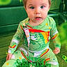 baby, bear, celebration, child, colorful, cute, eyes, face, floor, green_clothing, holiday, indoor, infant, pajamas, rainbow, shamrock, sitting, sparkles, st_patricks_day, text_overlay
