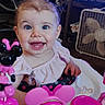 Willow is registered to the contest to win money with this photo: baby, child, smiling, blue_eyes, toy, pink, disney, minnie_mouse, activity_center, indoor, fan, television, happy, cute, infant, furniture, person, clothing, play, home