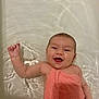 arm, baby, bath_time, bathtub, child, cute, face, happy, head, indoors, infant, one_person, playful, relaxing, skin, smiling, splash, towel, water, wet