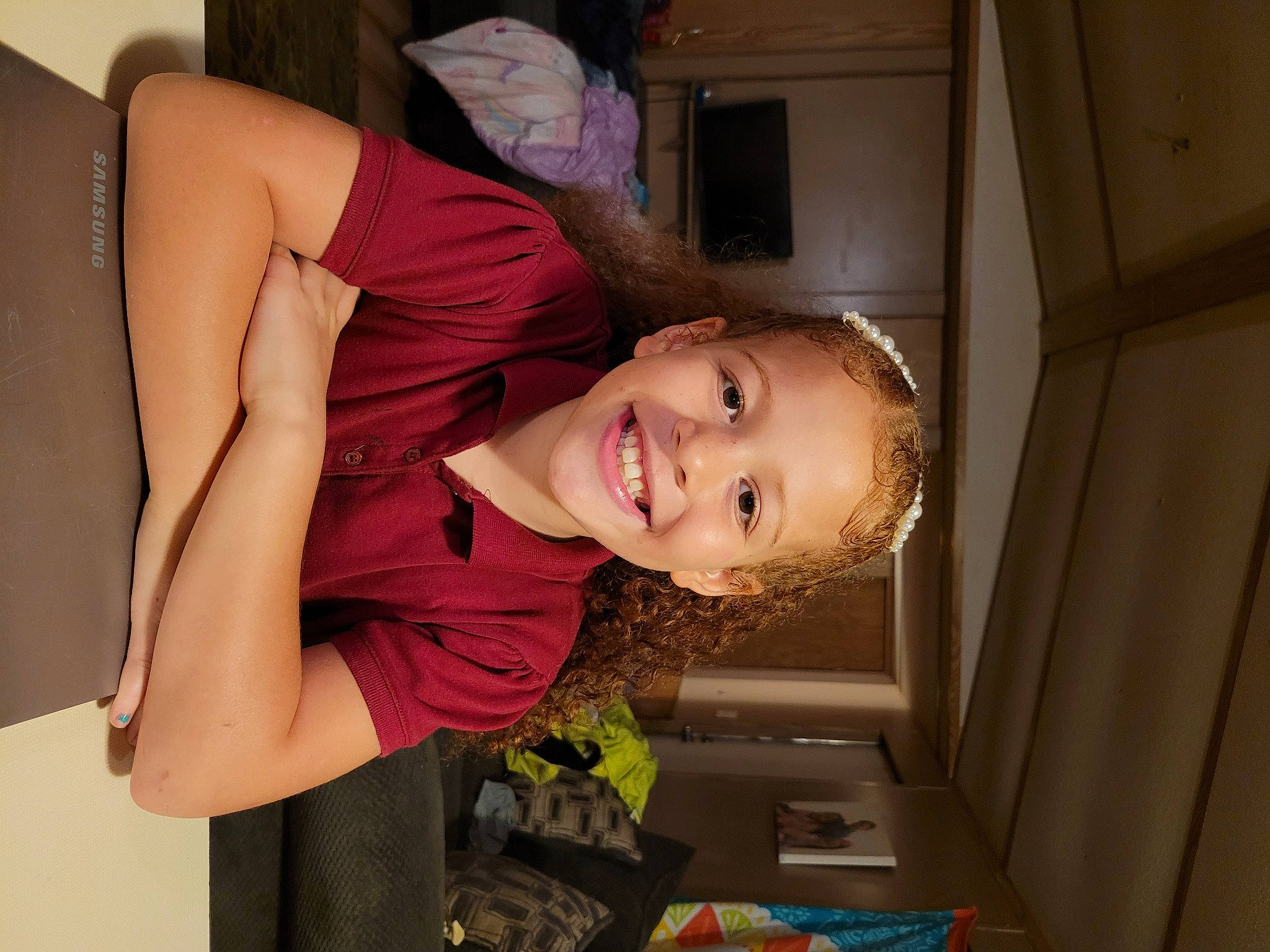 Mekiah is registered to the contest to win money with this photo: black_hair, chest, comfort, dress, elbow, flash_photography, fun, hairstyle, happy, human_body, human_leg, joint, joy, leg, long_hair, mouth, person, shoulder, smile, thigh