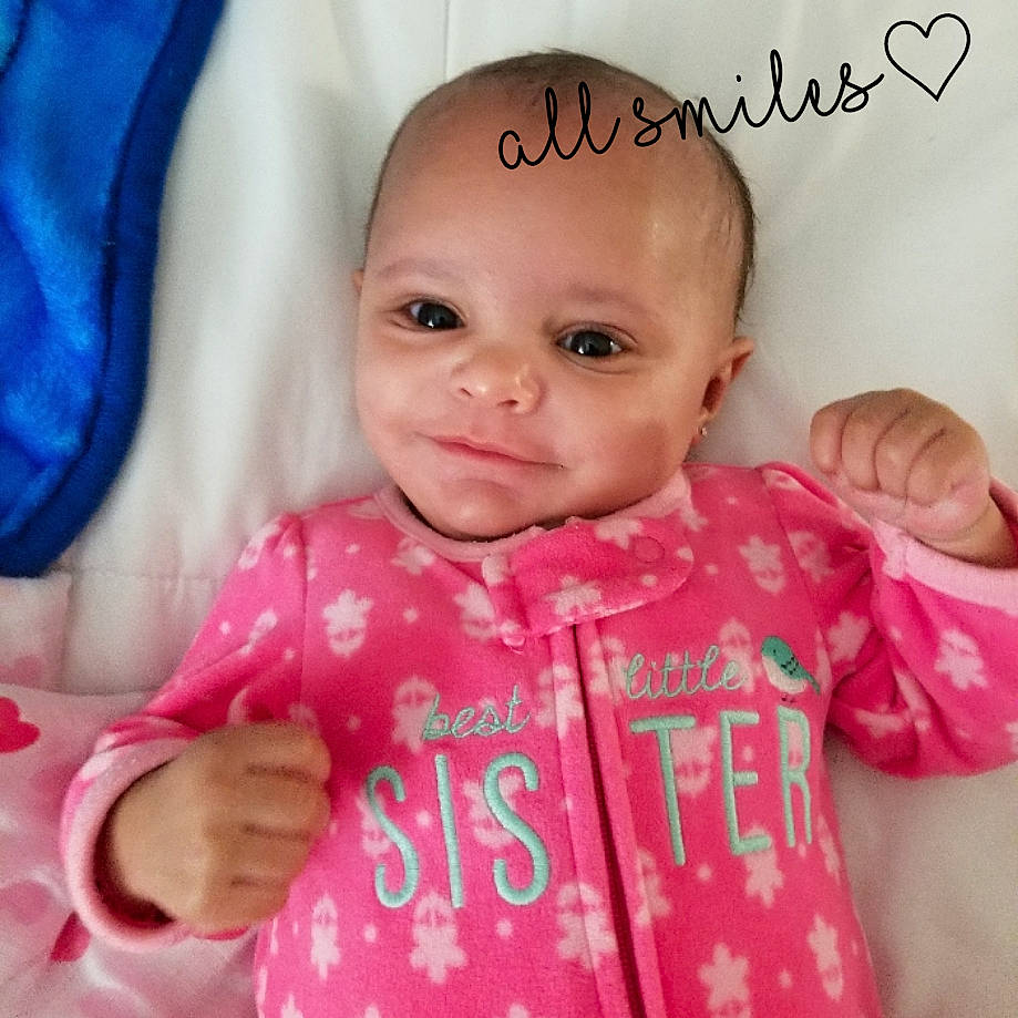 Khalia joined the competition — help win amazing prizes! baby, baby_making_funny_faces, baby_products, baby_toddler_clothing, cheek, child, face, happy, head, lip, nose, outerwear, person, pink, product, skin, smile, toddler