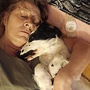Bandit participe au concours pour gagner de l'argent avec cette photo : affection, arm, blanket, casual, closeup, comfort, cozy, cuddling, dog, face, fur, glasses, indoor, love, nap, pet, relaxation, resting, sleeping, woman