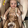 baby, child, car_seat, smiling, suspenders, brown_pants, beige, cute, infant, seatbelt, happy, clothing, person, portrait, indoors, baby_boy, sitting, cute_baby, car, safety