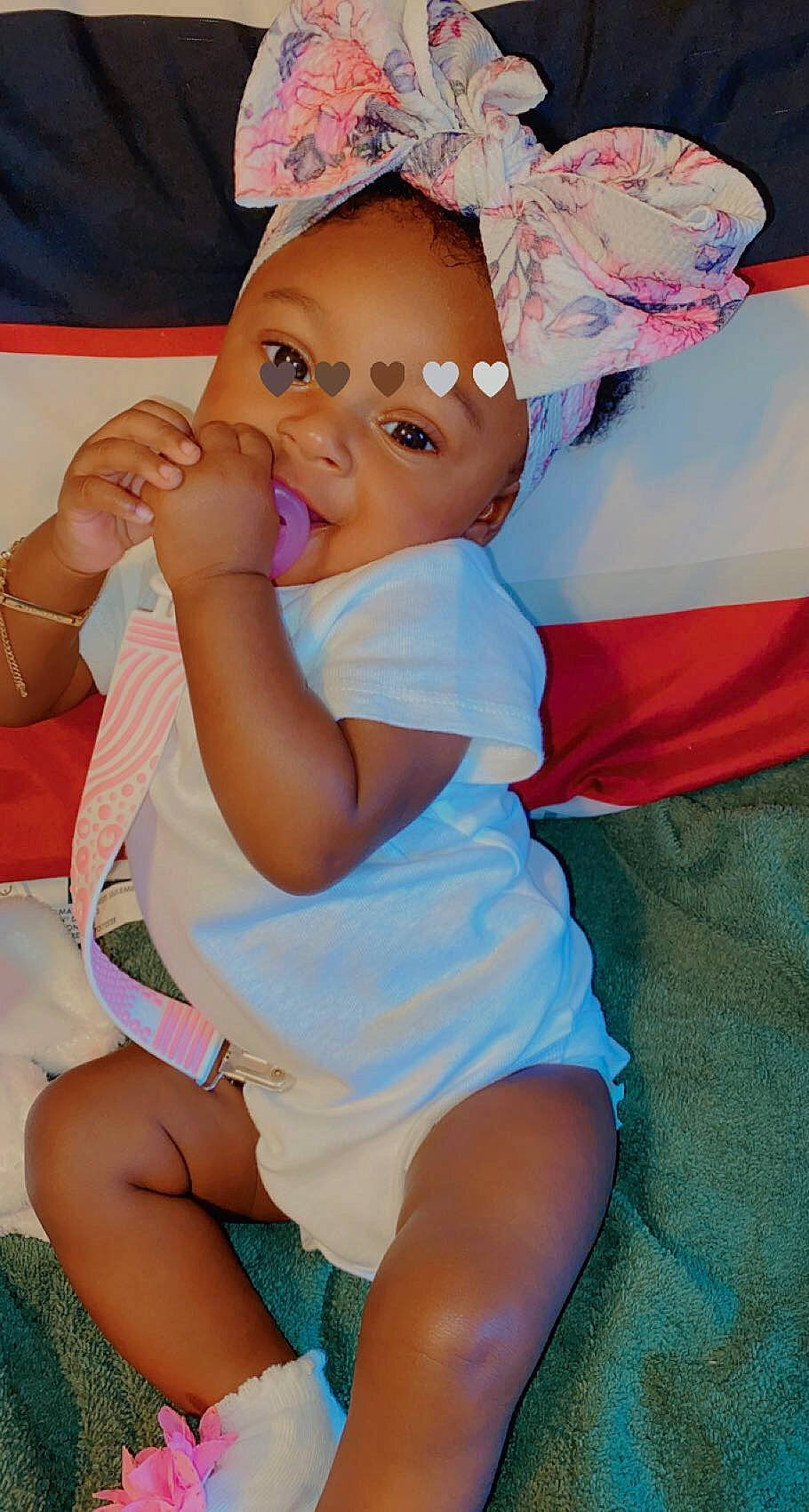 Ariyah Ford is registered to the contest to win money with this photo: baby_toddler_clothing, cheek, eye, face, finger, gesture, hand, happy, head, iris, leg, mouth, muscle, organ, person, pink, purple, skin, summer, thigh