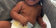 Apollo joined the competition — help win amazing prizes! baby, diaper, smile, toy, piano, infant, child, happy, playtime, indoors, couch, blanket, cute, face, skin, hand, legs, sitting, joy, young