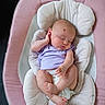 Freya is registered to the contest to win money with this photo: baby, baby_seat, child, cushion, cute, diaper, face, foot, hand, head, indoor, infant, newborn, peaceful, pink, purple_clothing, resting, skin, sleeping, toddler