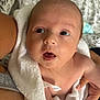 Natalie is registered to the contest to win money with this photo: baby, infant, towel, skin, face, eyes, mouth, hand, arm, person, newborn, cute, portrait, expression, soft, closeup, indoor, human, caring, comfort