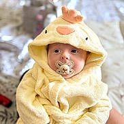 Natalie joined the competition — help win amazing prizes! baby, pacifier, towel, yellow, hooded_towel, child, infant, cute, soft, plush, face, hand, indoor, person, portrait, clothing, bed, blanket, comfort, warm